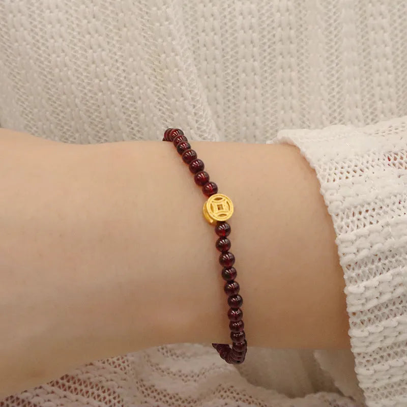 Chinese style gourd bracelet with imitation garnet stones and cultural motifs including Fu character design