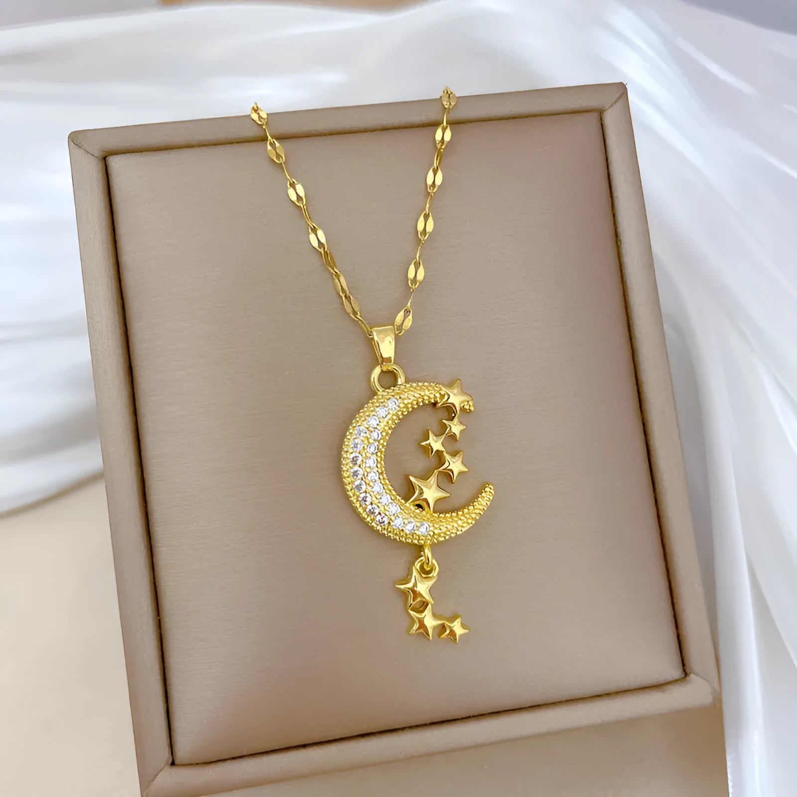 Geometric moon tassel necklace with diamond-cut facets and stainless steel chain
