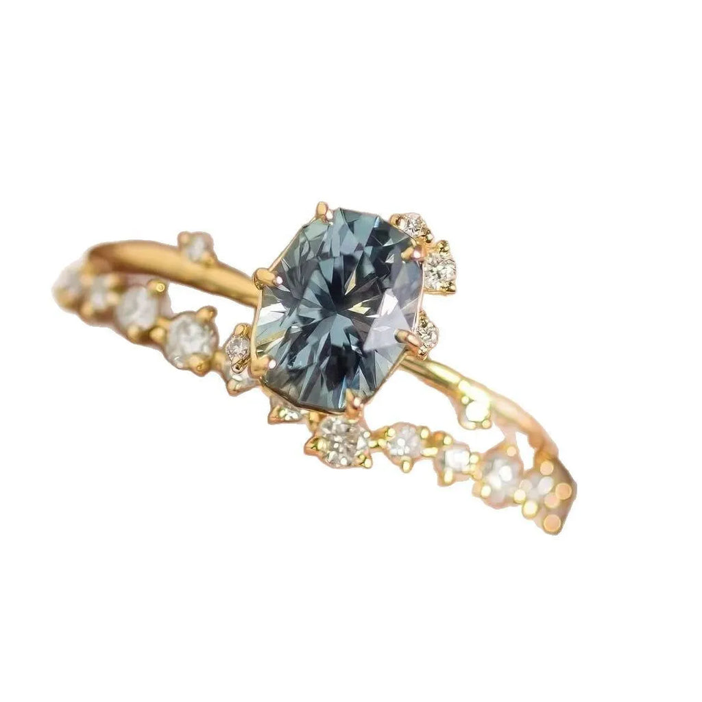 Gold plated floral shaped women's ring with green zircon stone details on alloy band