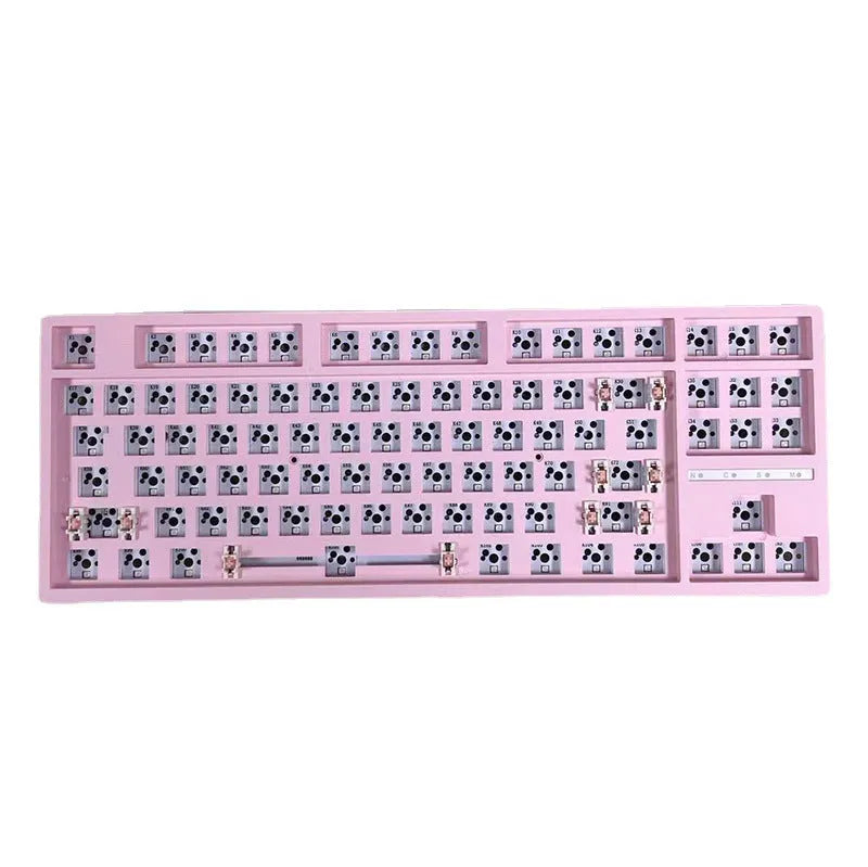 DIY mechanical keyboard kit with transparent case showing internal components and key puller tool