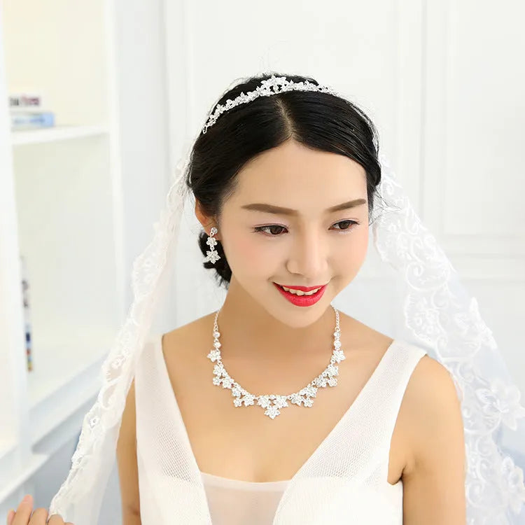 Korean crystal necklace and earring bridal set with crystal detailing on metal base