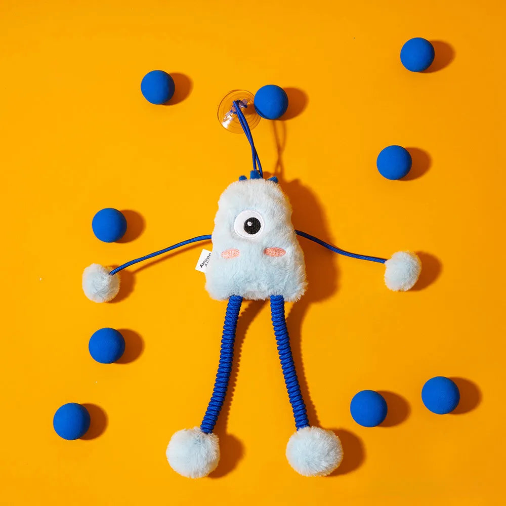 Blue plush elastic cat toy with bell in a ring shape on a light background
