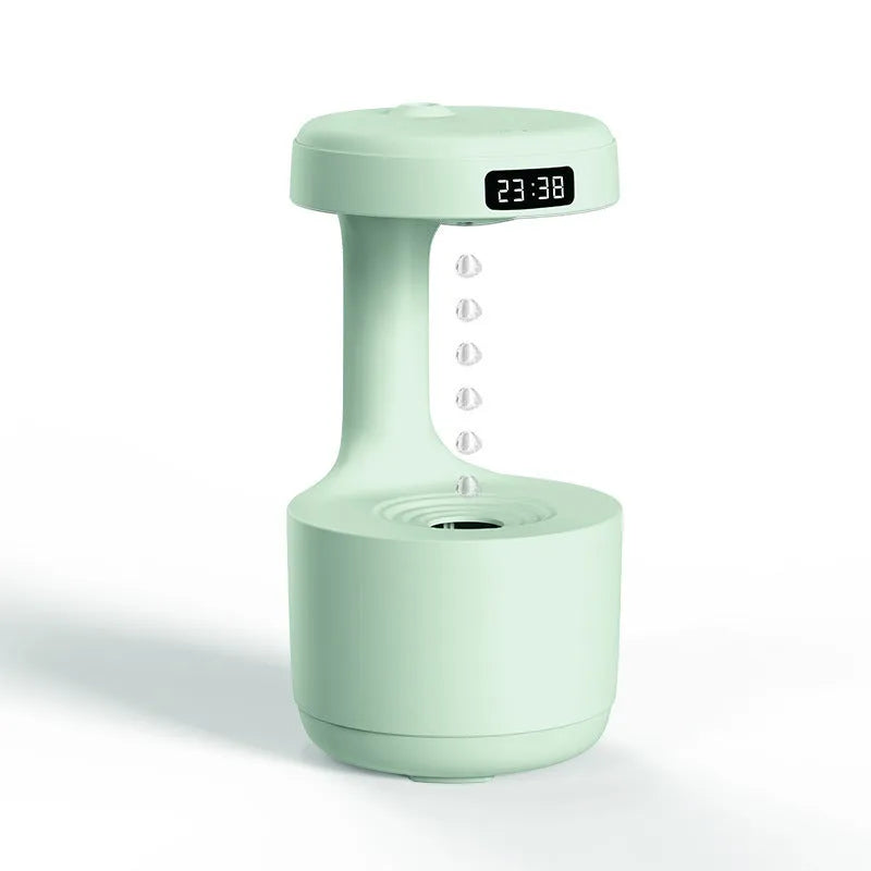 Rose gold and white levitating water drops ultrasonic humidifier and LED night light on a desk
