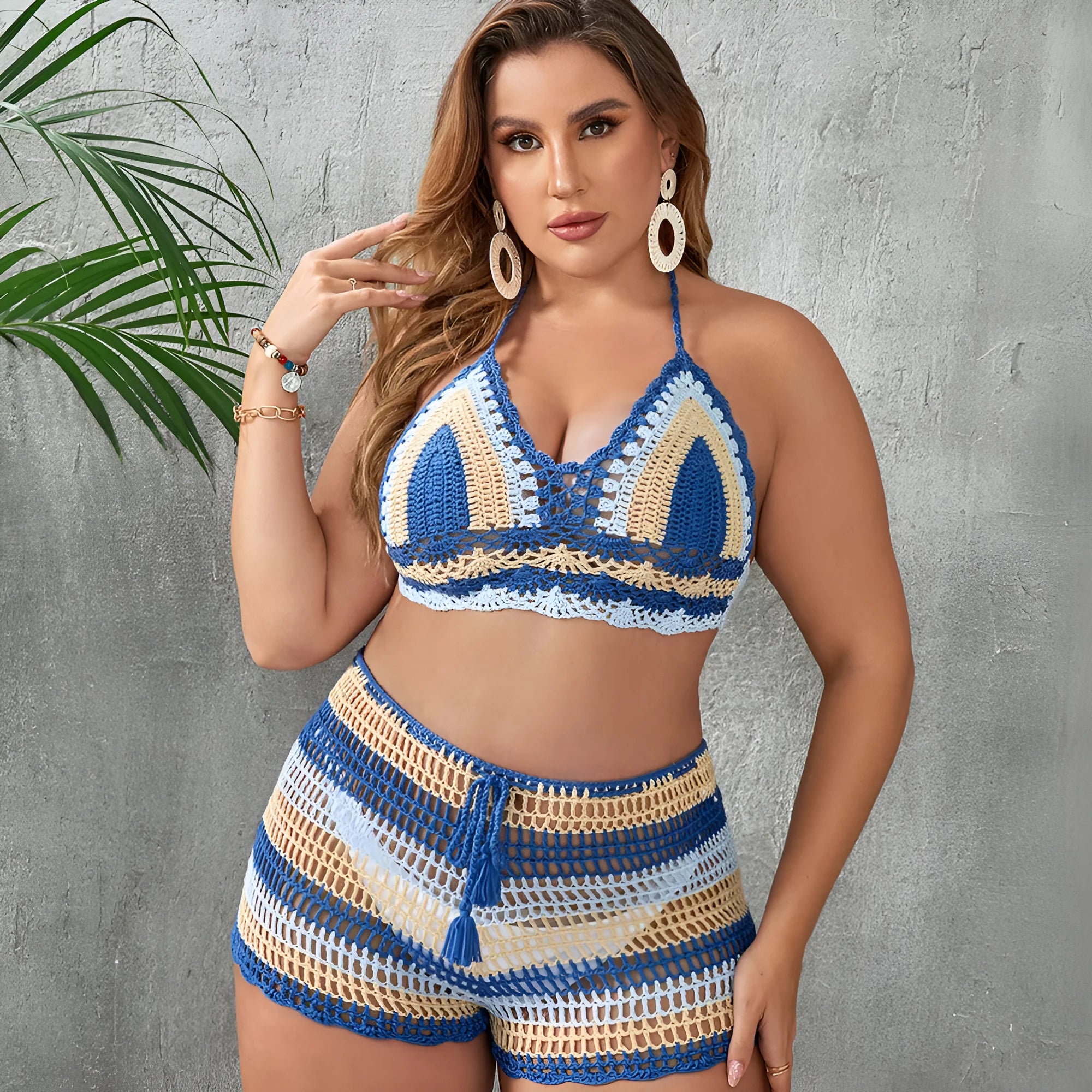 Women's blue swimsuit with hollow out straps and side split detail in briefs cut