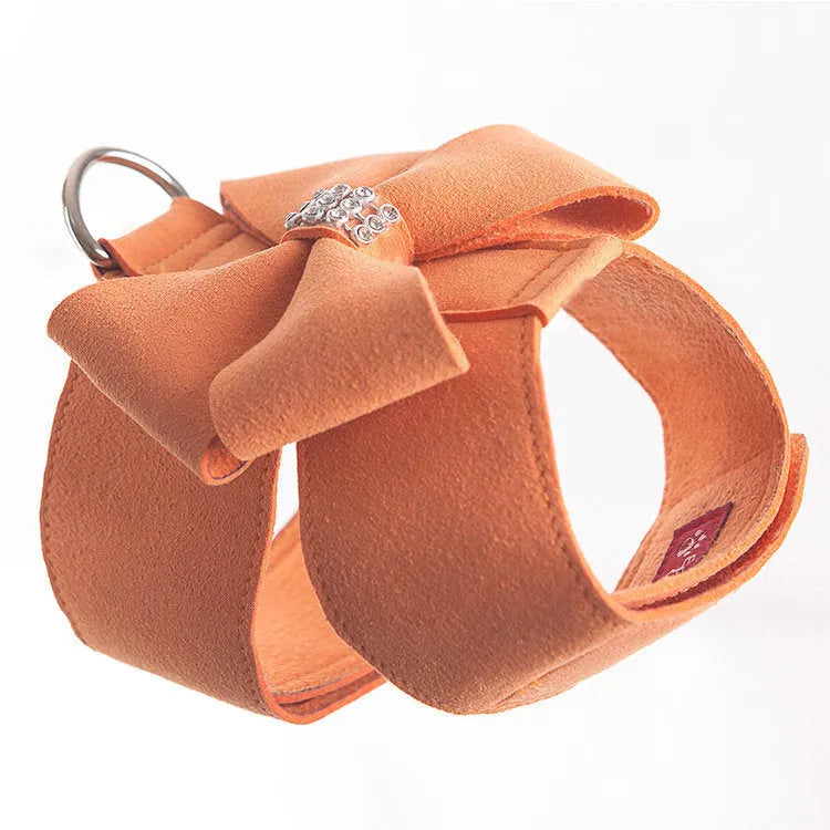 Puppy wearing microfiber chest strap with bowknot design in pink, blue, or orange colour