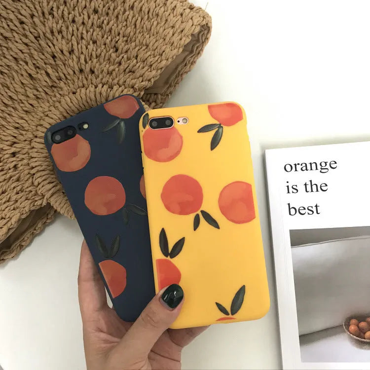 Orange matte finish TPU silicone case for iPhone on a table.