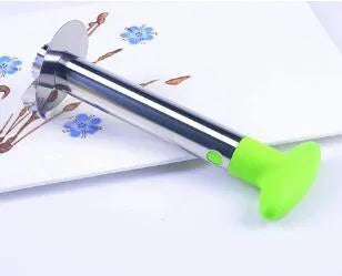 Stainless steel pineapple corer slicer with ABS handle on a kitchen worktop