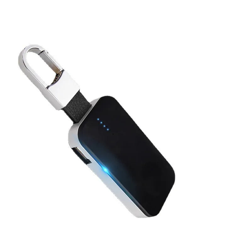 Black Apple Watch wireless keychain power bank on a keyring showing its compact size.