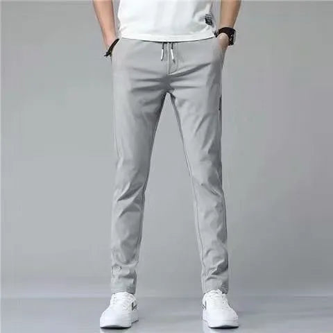 Men's drawstring trousers Korean version loose straight leg sweatpants in khaki colour on model