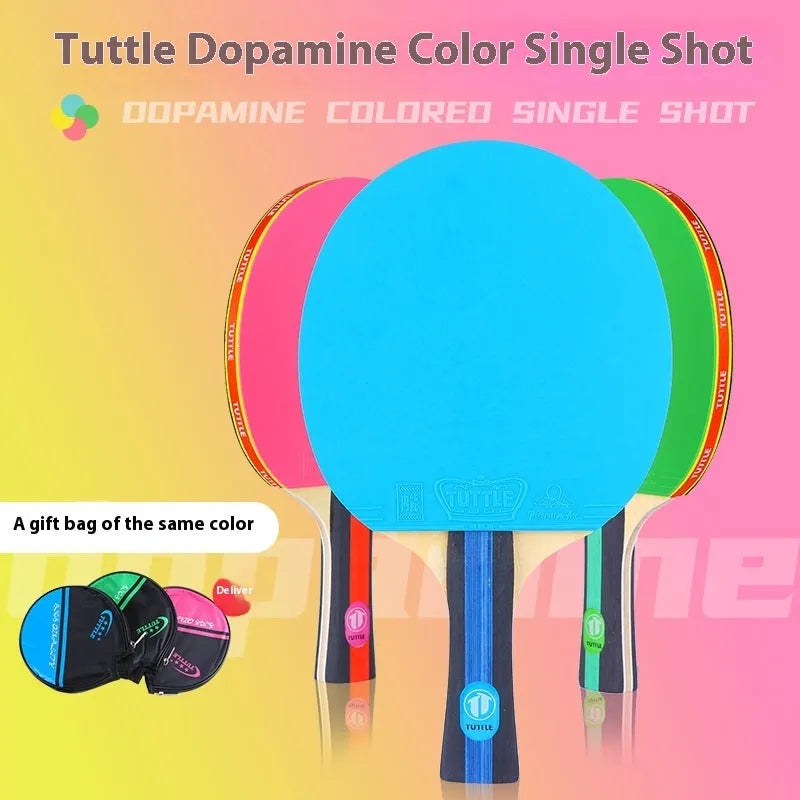 Pink, blue, and green table tennis rackets with long shakehand grips and matching protective cover bags.