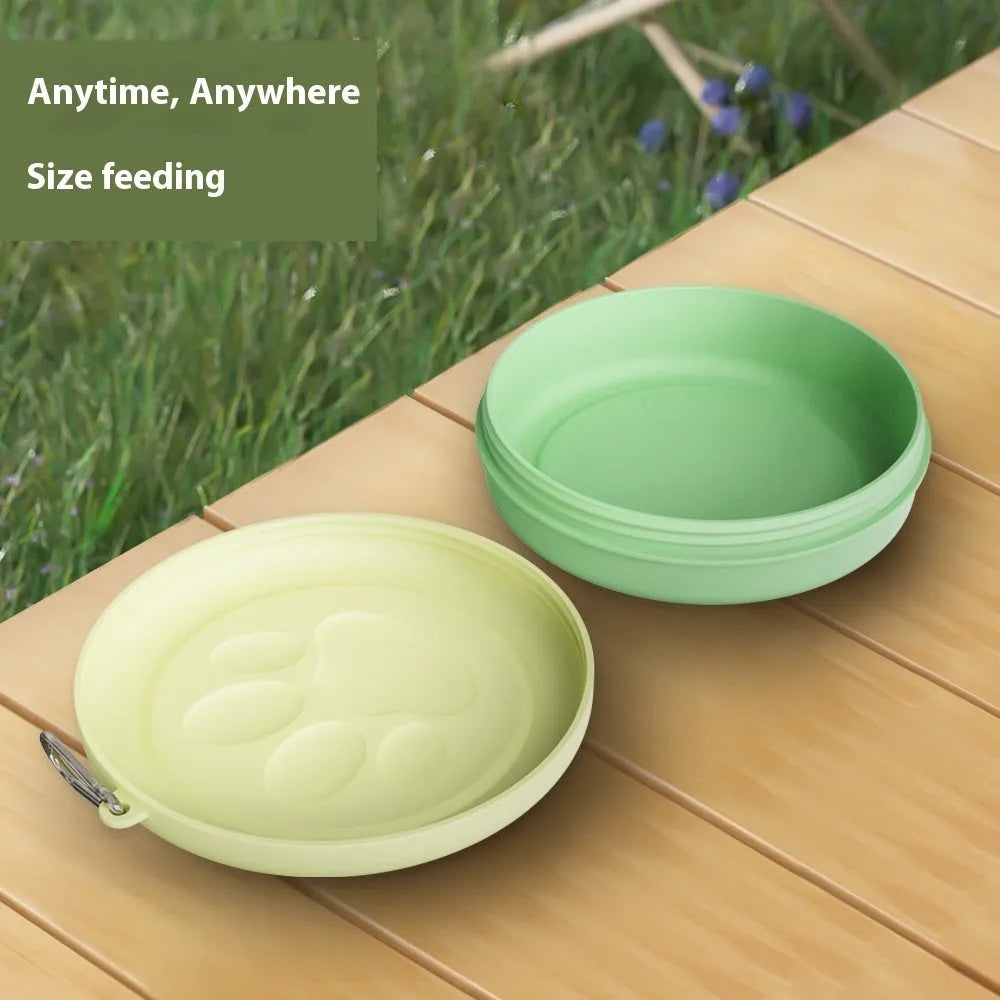 Portable plastic dog feeding bowl with integrated snack box compartment in light green colour