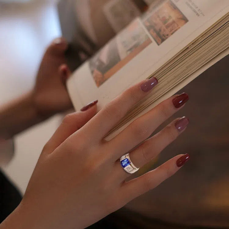 Sapphire retro crystal alloy ring in rose gold with antique finish and geometric irregular shape on white background