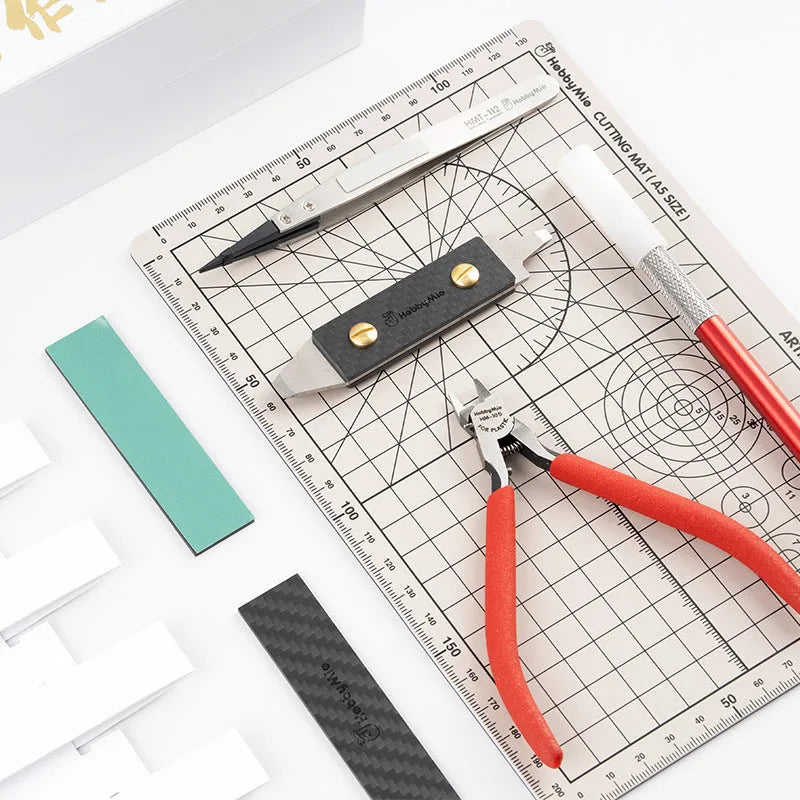Meow Maker model tool set with metal implements and miniature handmade suit for crafting projects