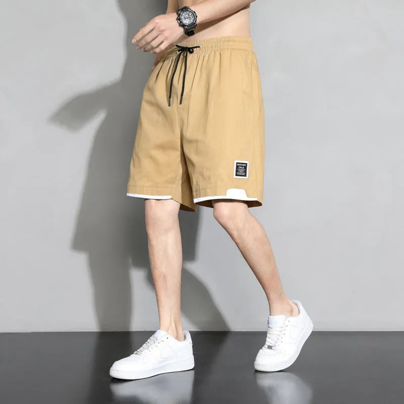 Boy wearing black cotton plus-size shorts with a mid-waist and casual overalls style.