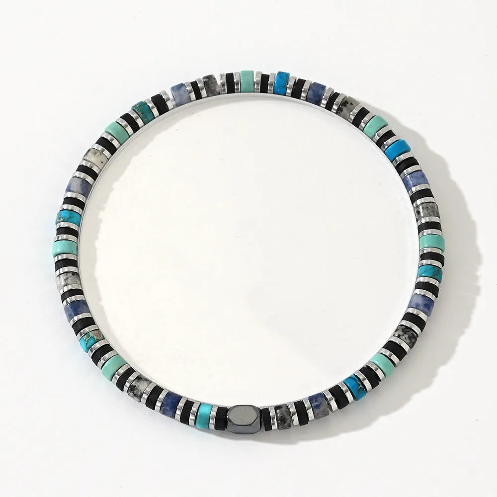 Hand-woven bohemian cylindrical bracelet with natural semi-precious stones in geometric arrangement