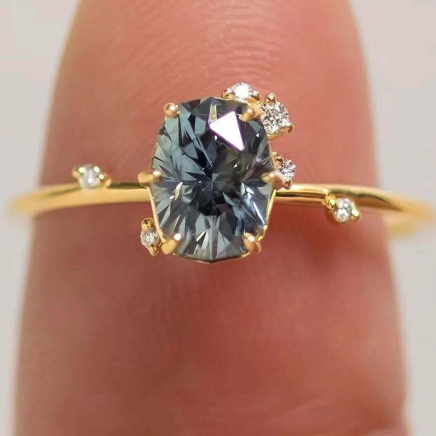 Gold plated floral shaped women's ring with green zircon stone details on alloy band