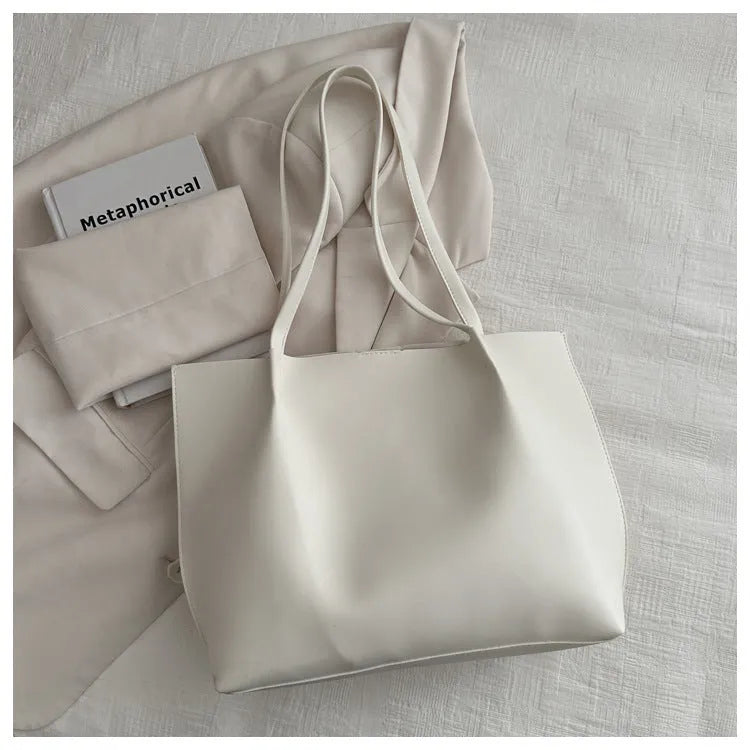 Casual messenger bag in PU leather with stitched detail, bucket shape, double shoulder straps, available in black brown coffee white