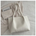 Casual messenger bag in PU leather with stitched detail, bucket shape, double shoulder straps, available in black brown coffee white