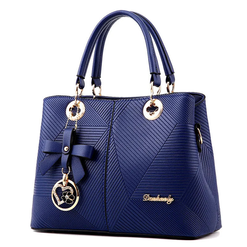 Retro style women's handbag in PU leather with a zipper and adjustable strap in five colour options.