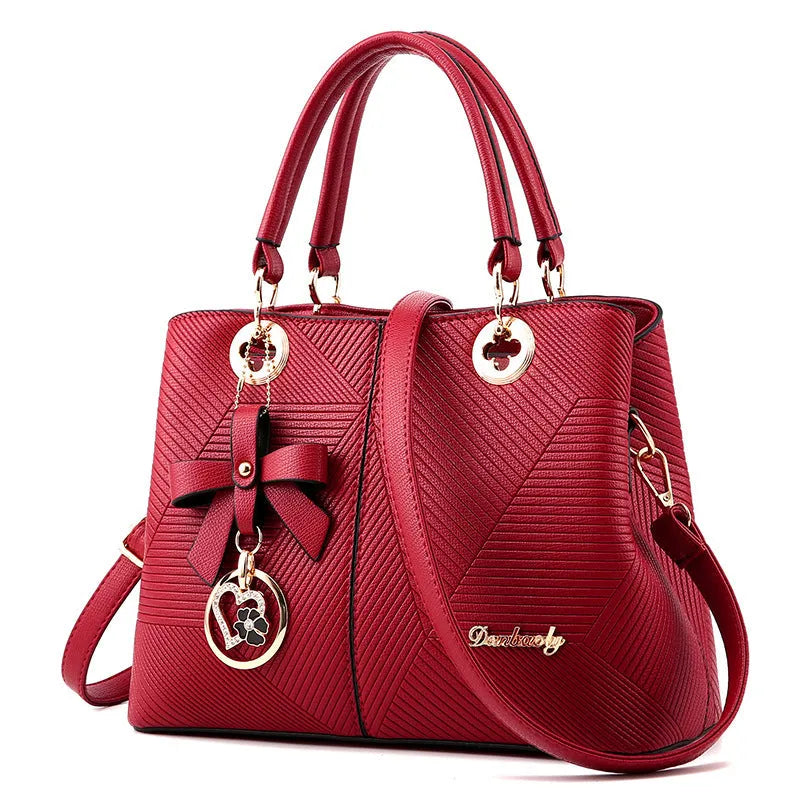 Retro style women's handbag in PU leather with a zipper and adjustable strap in five colour options.