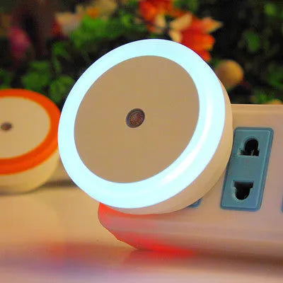 Round halo LED induction nightlight in blue, red, white, and yellow for market stalls.