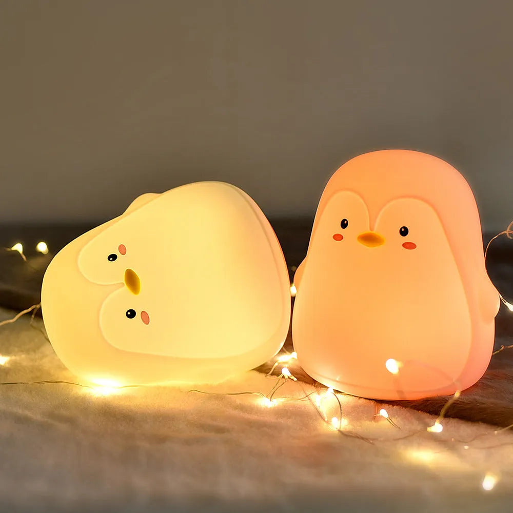 White penguin-shaped night light with USB rechargeable battery and soft LED illumination