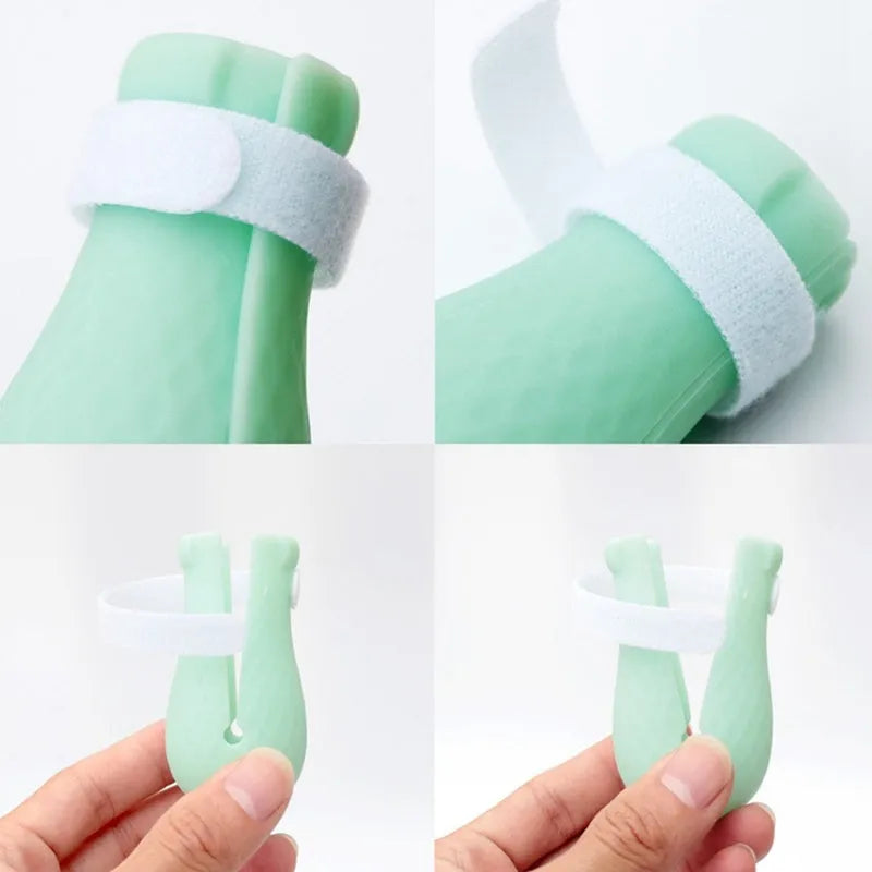 Green silicone cat bathing feet washing set with nylon buckle strap on a surface