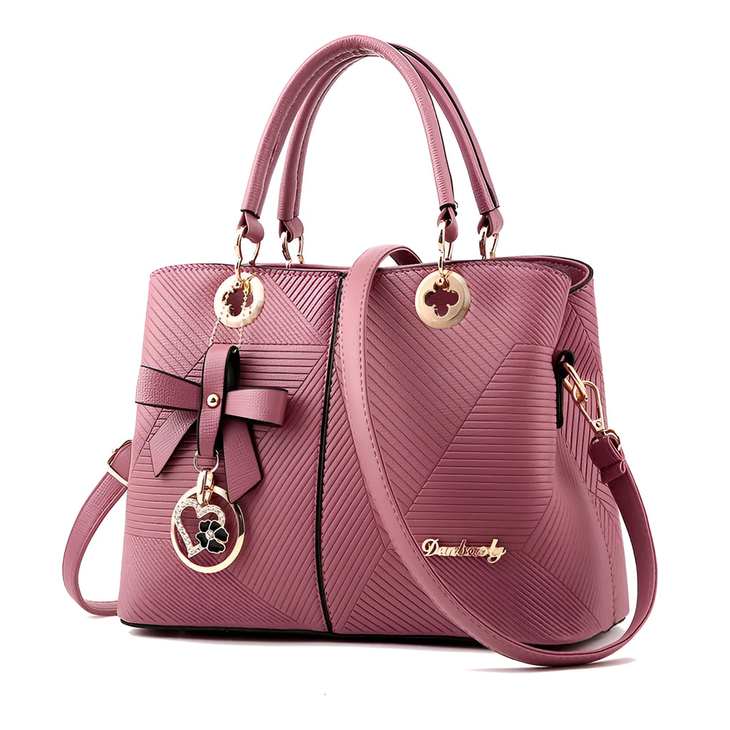 Retro style women's handbag in PU leather with a zipper and adjustable strap in five colour options.