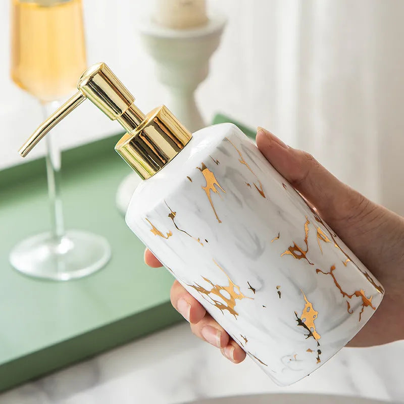 White ceramic bathroom wash set with marble finish showing two cups, soap box, and latex bottle