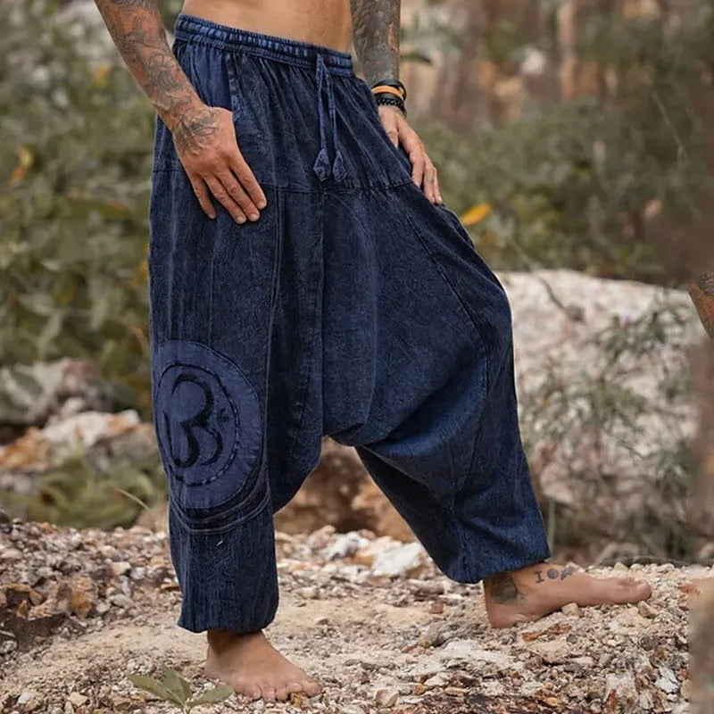 Men's dark green ethnic pattern trousers with elastic ankle ties, mid-waist design