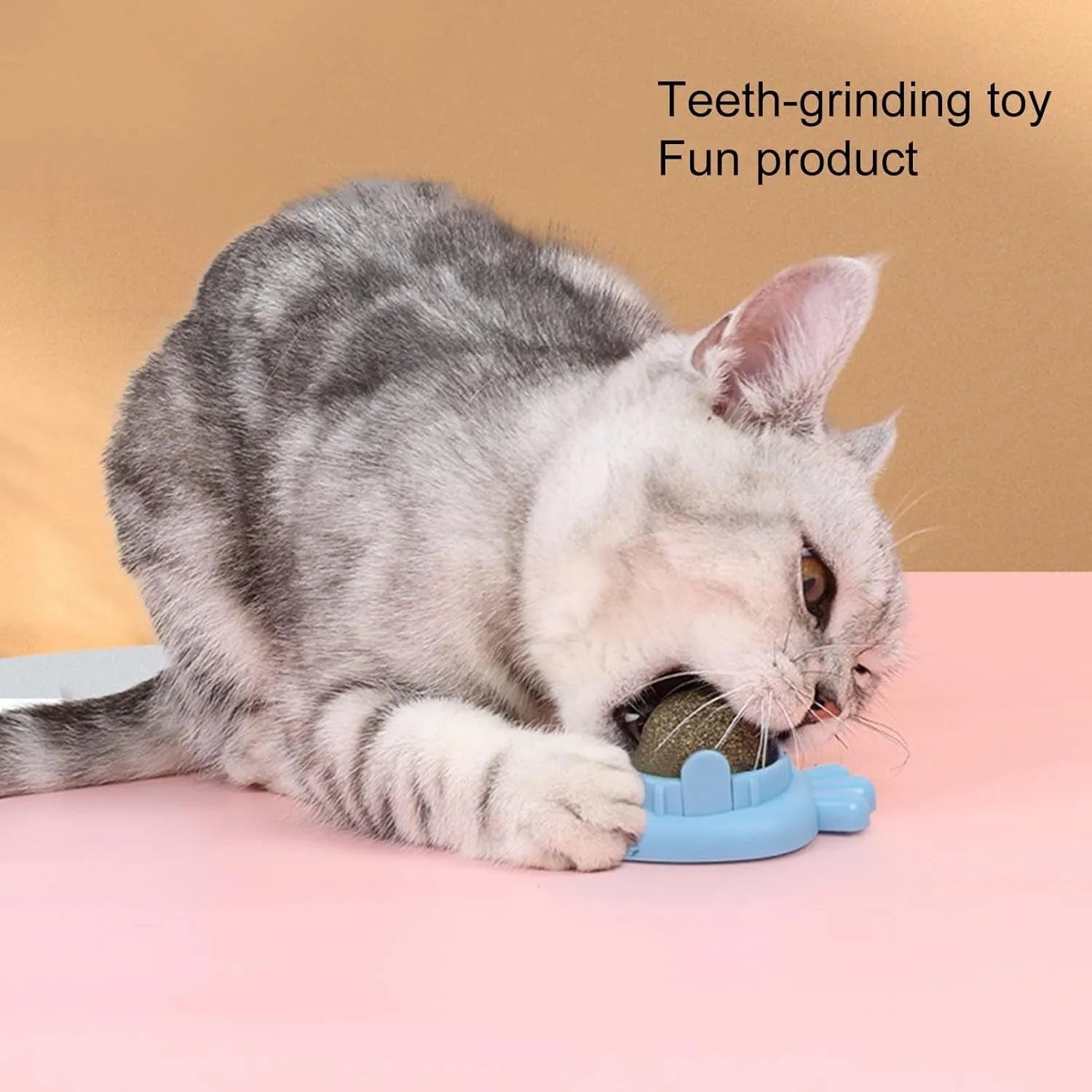 Blue carrot-shaped catnip toy with self-adhesive sticker for wall mounting and teeth cleaning