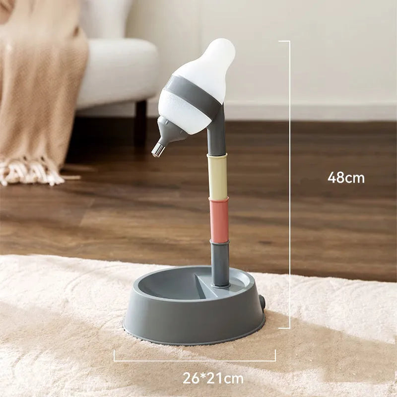 Green adjustable pet standing water dispenser with detachable pole and bowl on a grey floor.
