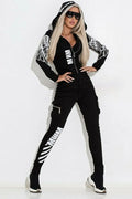 Women's black casual suit with wings printing, hooded zipper top, and matching trousers for street fashion.