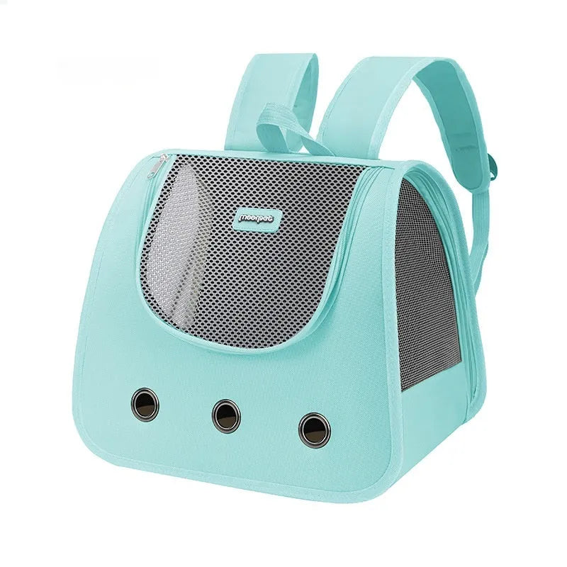 Light blue Oxford fabric cat backpack carrier with mesh panel, shown on a person's back.