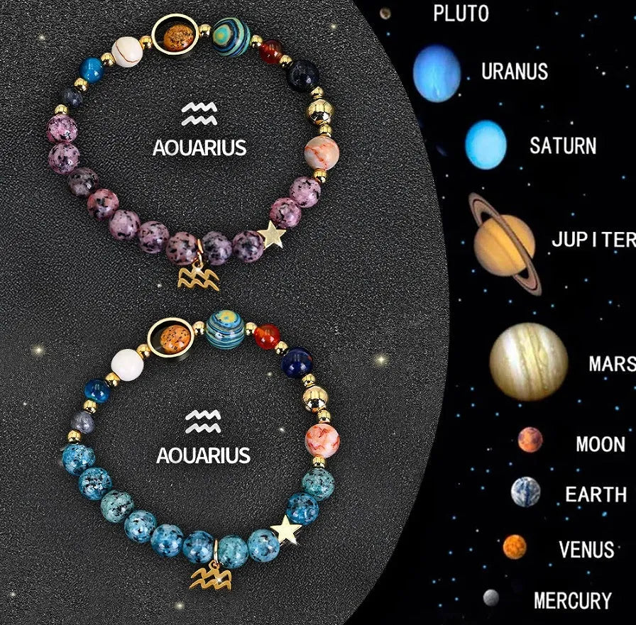 Two natural stone beaded bracelets with zodiac charms on a table.