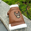 Black leather dog jacket shown on a medium-sized dog for autumn and winter wear.