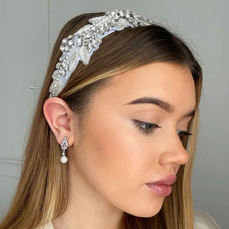 Gold, platinum, and rose gold plated geometric flower earrings with micro-inlaid zircon and pearl details.