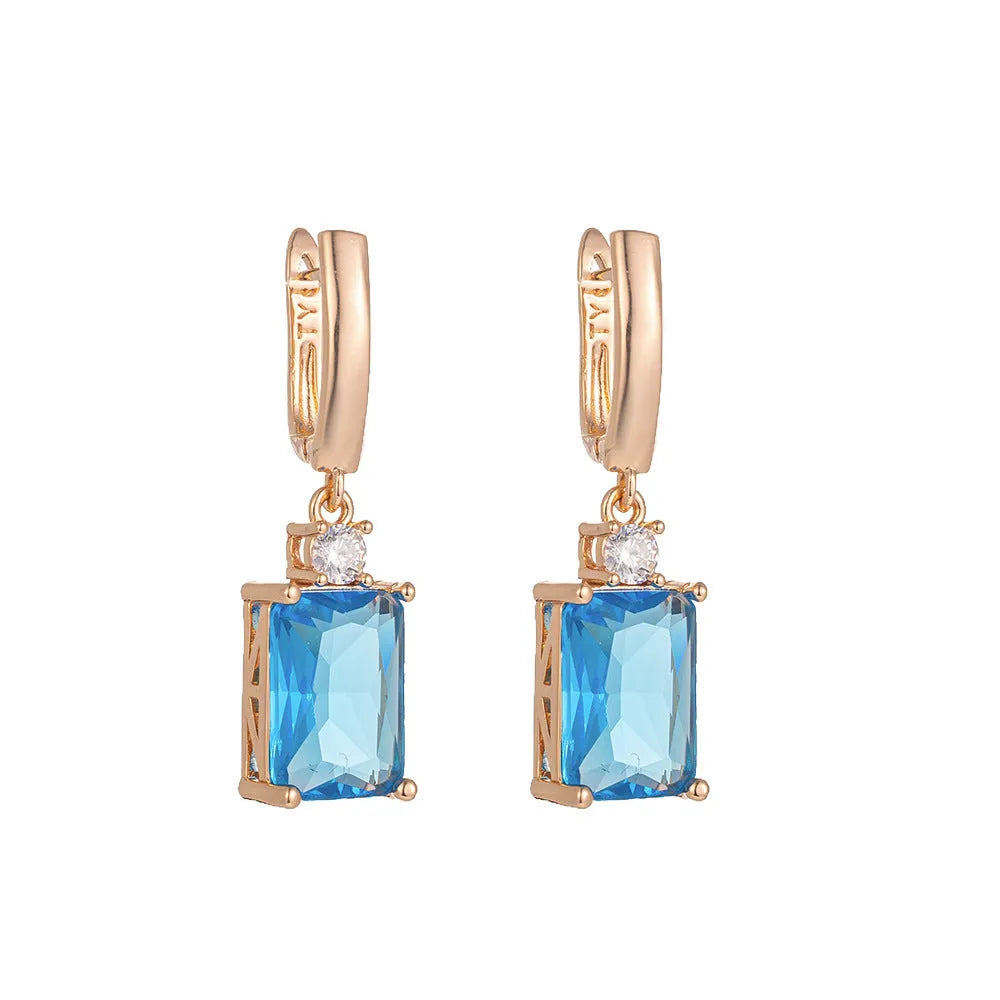 Square copper earrings with electroplated gold or silver finish and quadrilateral geometry