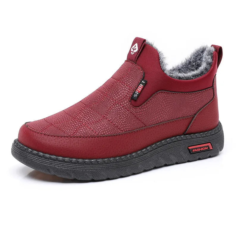 Women's black casual flat ankle boots with a round toe and non-slip rubber sole.