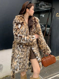 Street fashion faux fur coat with fur collar and pockets in artificial fur fabric