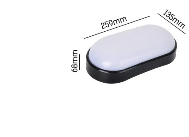 Black oval LED wall light surface mounted on a porch with warm white illumination