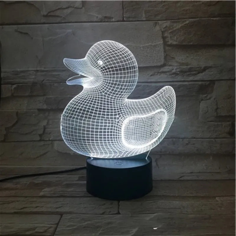 Little yellow duck 3D acrylic night light with colour-changing LED and remote control on table