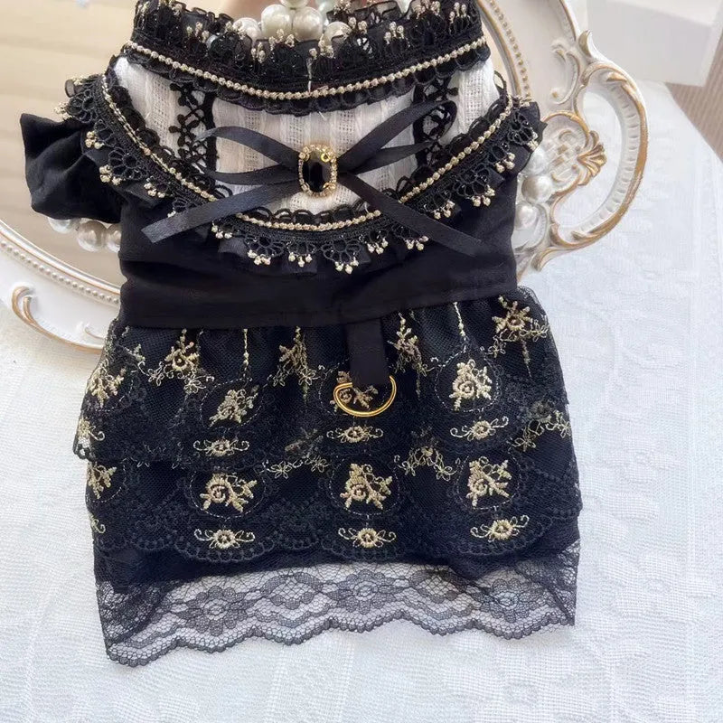 Golden gothic-style skirt dress for cats or dogs on a mannequin showing princess design and polyester fabric