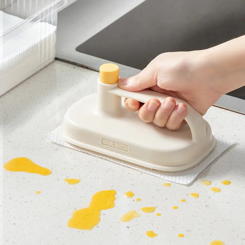 Disposable Magic Brush cleaning tool with plastic handle and stack of 50 white non-woven fabric refill rags.