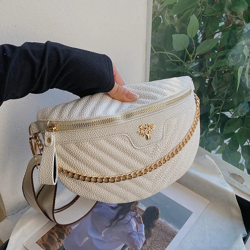 Women's one-shoulder chain crossbody bag in white PU with sandwich pocket and zipper change bag on a model