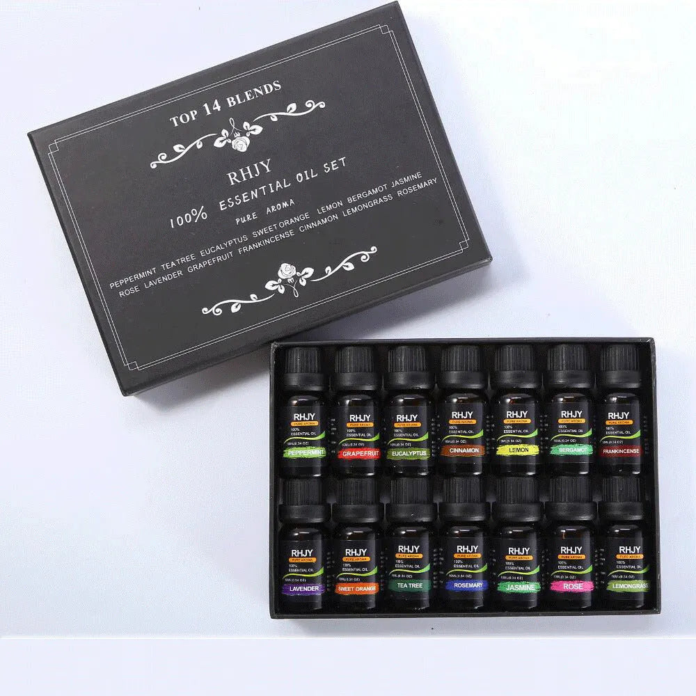 Essential oil set of 14 fragrances in 10ml bottles including rose, lavender, and lemon on a surface