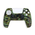 Camouflage patterned silicone grip case fitted on a black Sony PS5 DualSense controller.