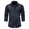 Men's slim fit long sleeve denim shirt in a solid colour on a hanger.
