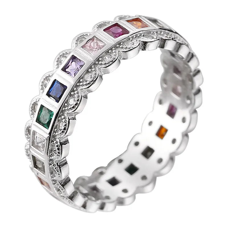 S925 sterling silver adjustable lace ring with rainbow zircon stones on a white background.