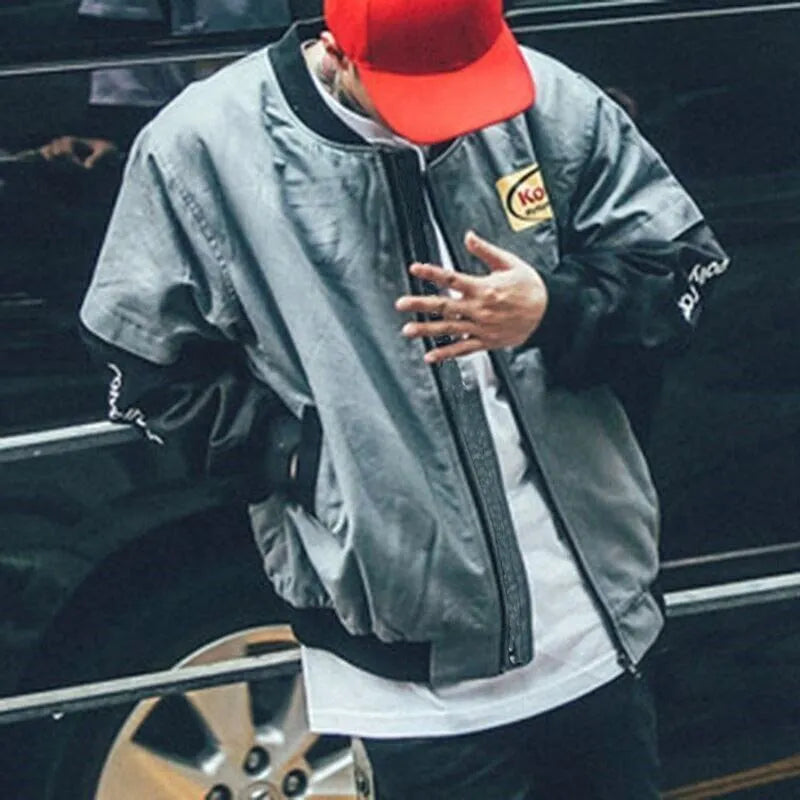 Hip hop style cotton print baseball jacket for men and women, grey colour, front view with side pockets
